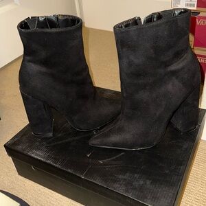 Black pointy high-heeled ankle boots